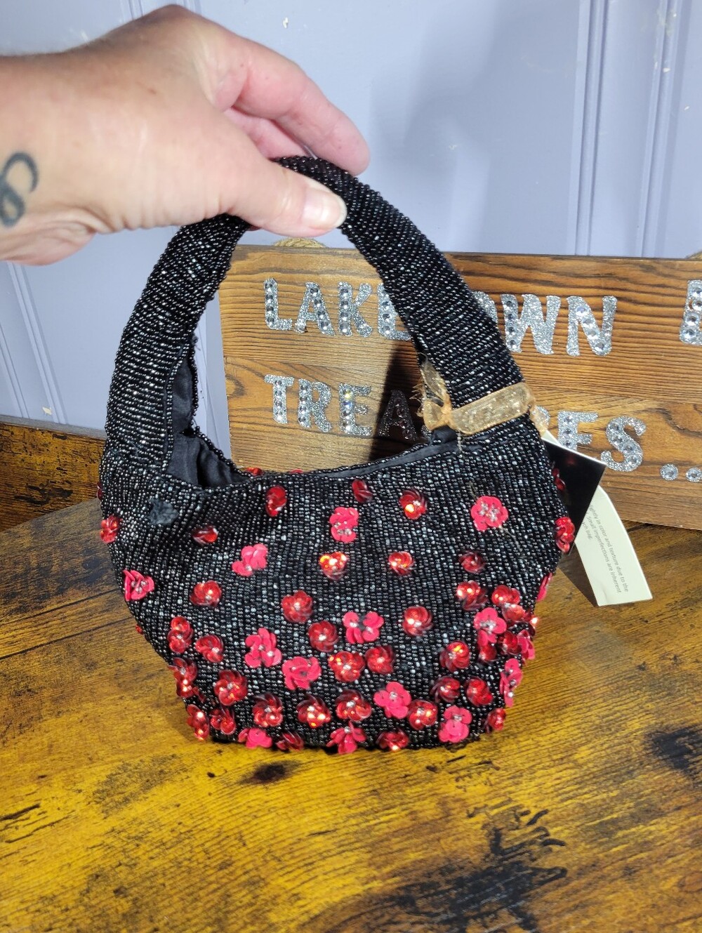 From India to you Beaded Black Handbag with Red Floral Embellishments